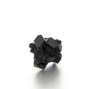 Handmade minimalist unisex jewelry design Vienna. Small black resin brooch.